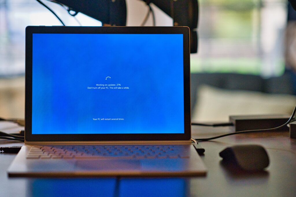 Why Operating Systems Evolve 2 A Microsoft Surface book updating it's operating system software.